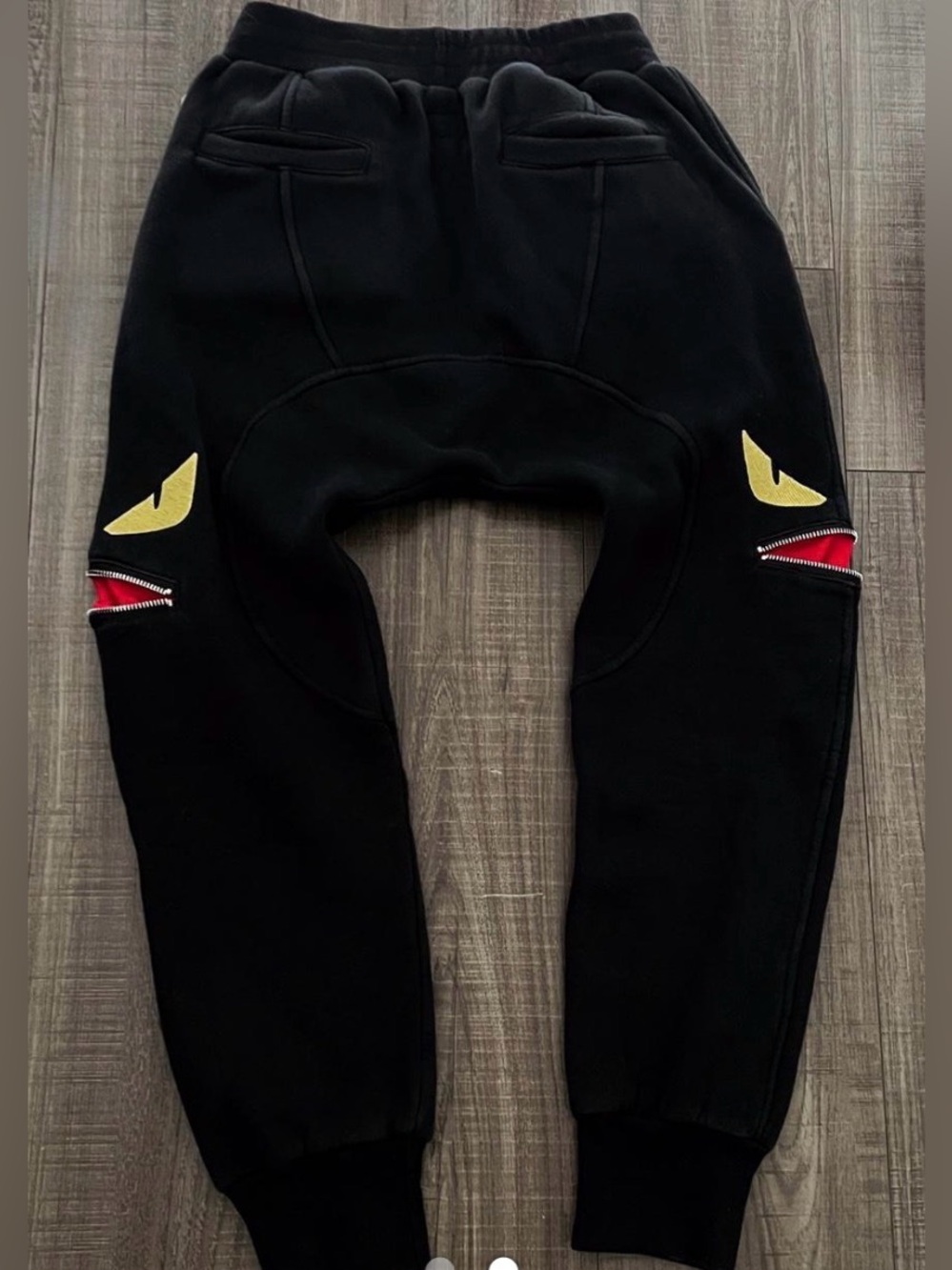 Fendi łKids Black Jogger Pants with Yellow Eye and Red Zip  size S